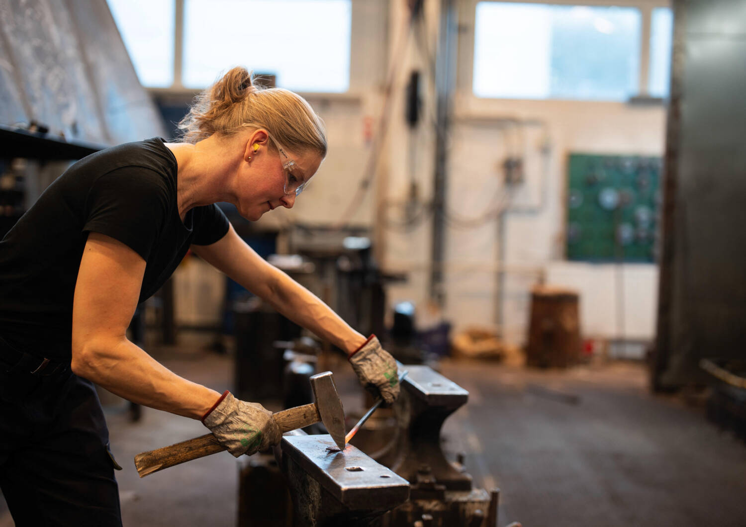 Blacksmith working with metal.