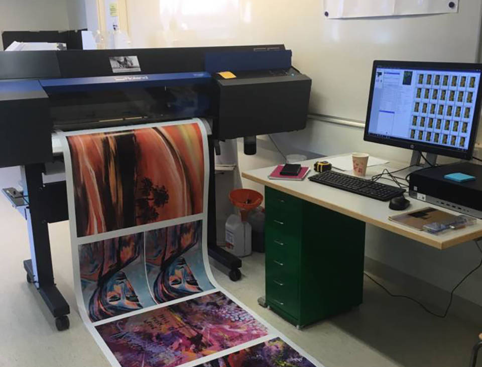 Large format printer and printed posters.