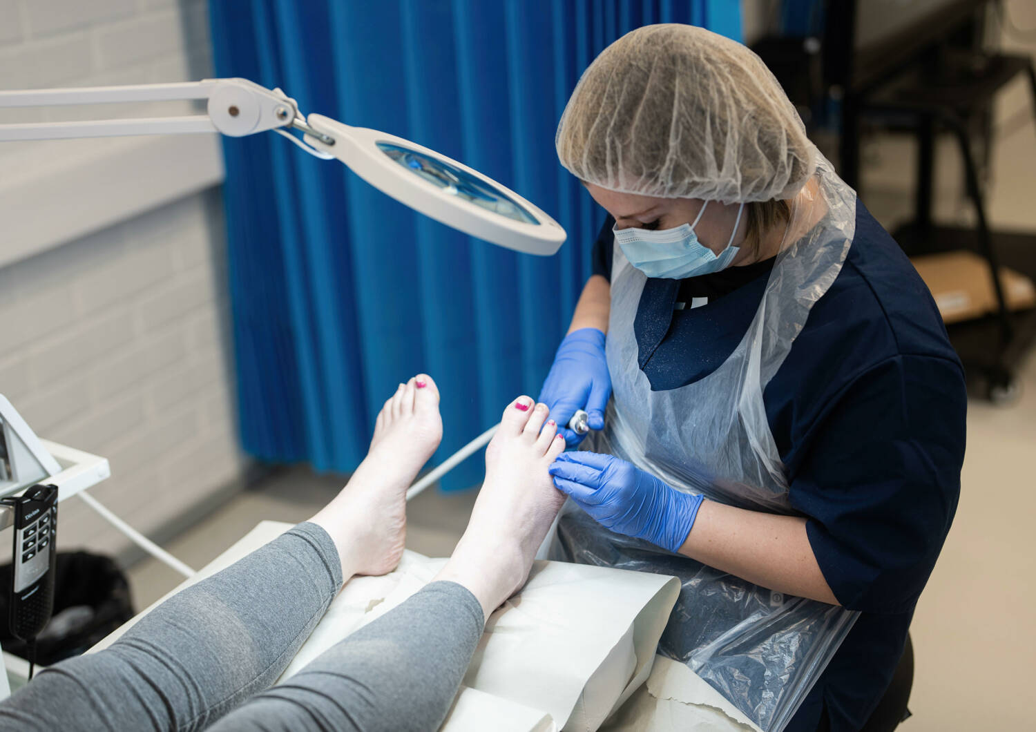 Person is working in Foot clinic.