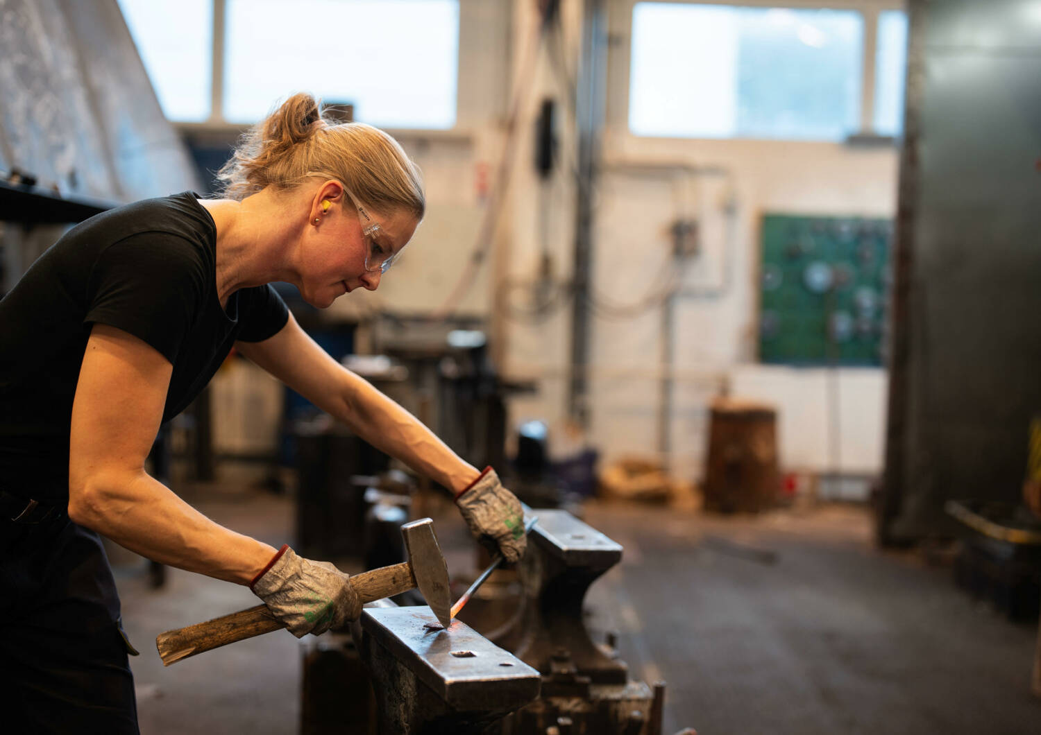 Blacksmith working with metal.